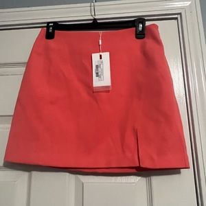 Coral skirt with slit- tags still on it- size medium